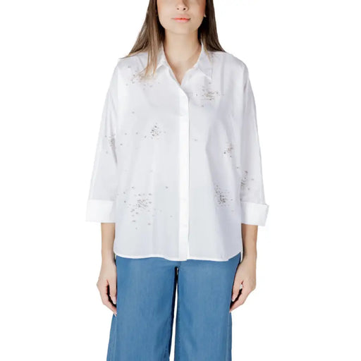 Woman wearing a white embellished button-down shirt from Womens White Embellished Button Down Shirt collection