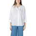 Woman wearing a white embellished button-down shirt from Womens White Embellished Button Down Shirt collection