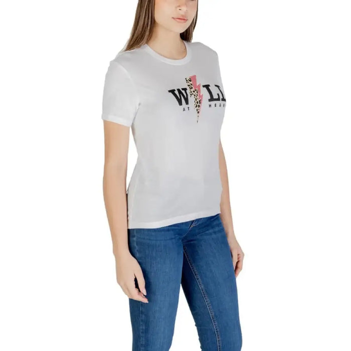 Woman wearing a white graphic tee offering a casual and stylish look