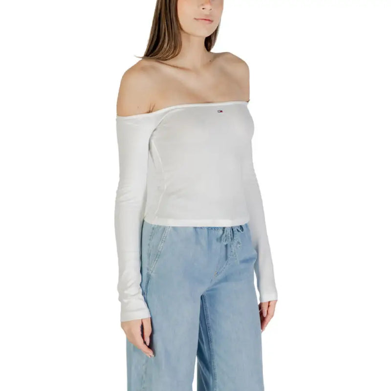 Woman wearing a white off-the-shoulder long-sleeved top from Womens White Off The Shoulder Long Sleeved Top collection