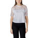Woman wearing a white sheer-overlay top with black pants in Black Mesh Overlay Two Piece Set