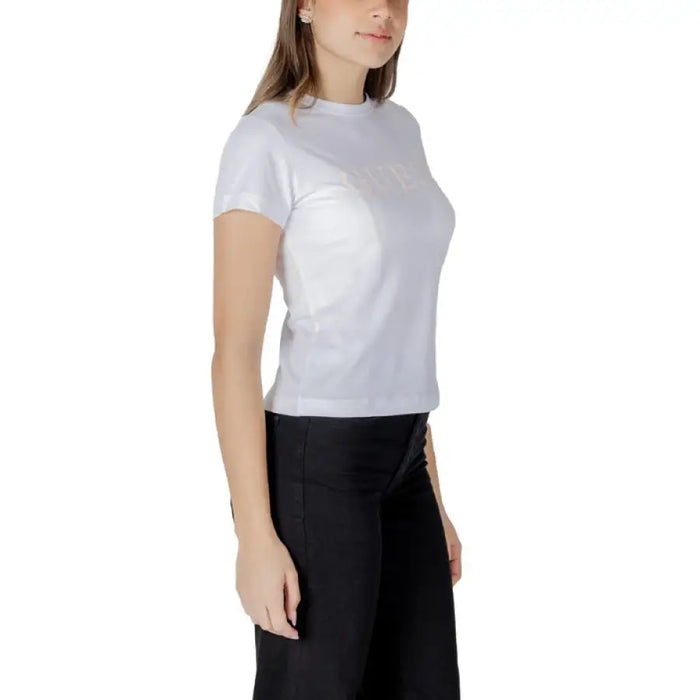 Woman wearing a white short-sleeve T-shirt and black pants for the White T-Shirt with Short Sleeves product