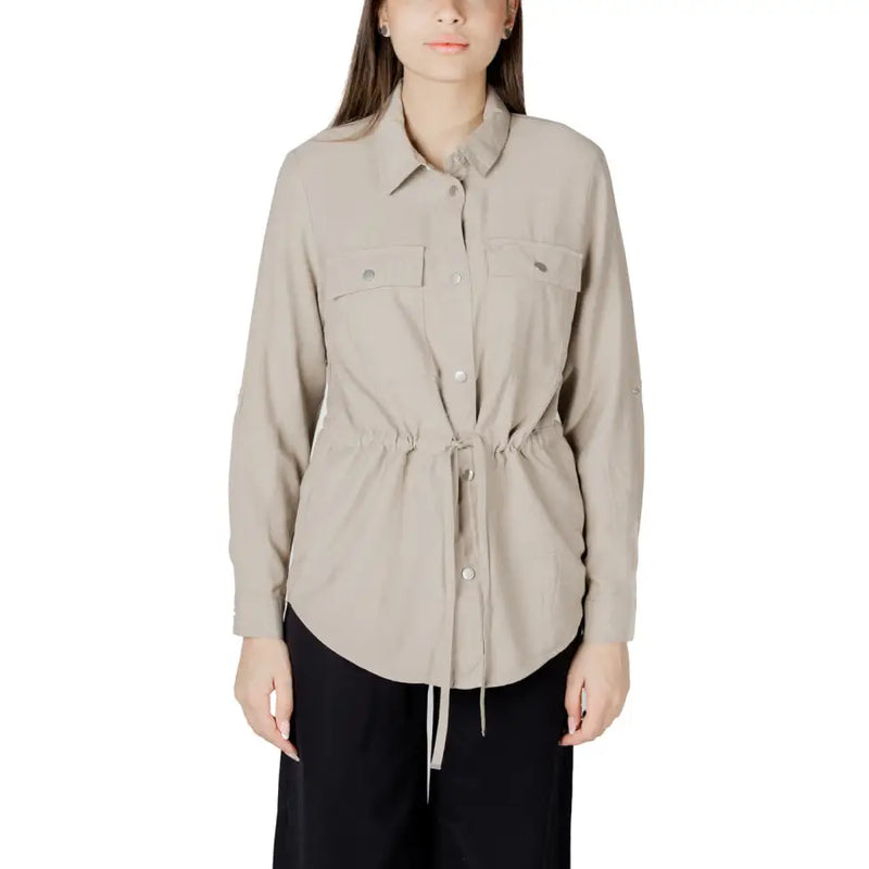 Womens beige button down blazer with long sleeves two chest pockets and a drawstring waist closure