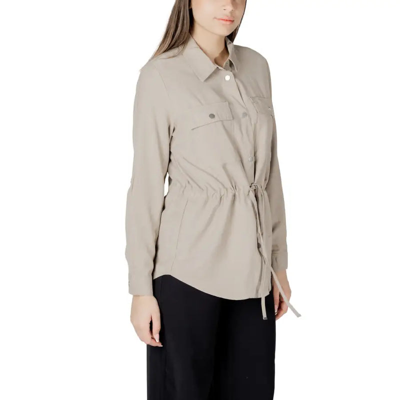 Womens beige button down blazer with long sleeves drawstring waist and two chest pockets in soft fabric