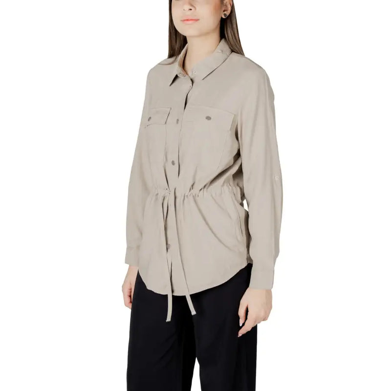 Womens beige button down drawstring blazer with long sleeves, two chest pockets, and a drawstring waist