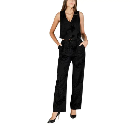 Women wearing Desigual Black Floral Fall Winter Trousers with sleeveless vest