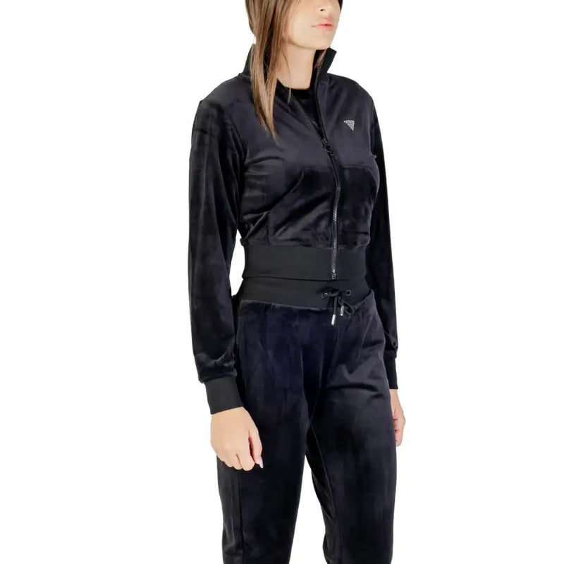Women’s black velvet tracksuit featuring rhinestone zip front sweatshirt by Guess Active