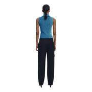 Women wearing a blue sleeveless top and dark blue cargo pants with front pockets