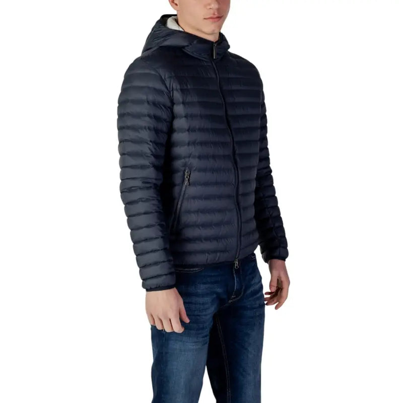 Dark navy women’s nylon puffer jacket with horizontal quilting and white fleece hood lining with zip and pockets