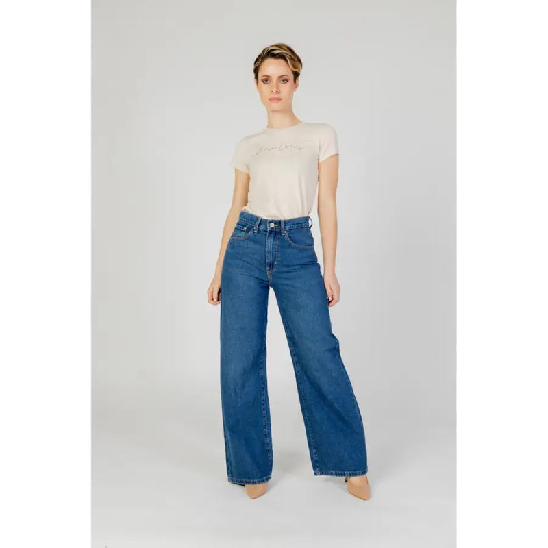 Women’s high-waisted blue plain cotton jeans with a wide-leg cut and denim material for casual wear