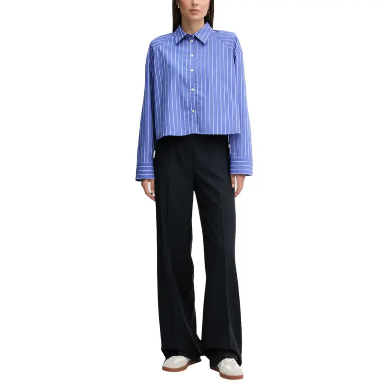 Calvin Klein Jeans women’s blue and white striped long sleeve button-up shirt