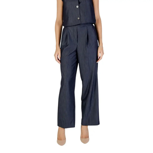 Women’s dark blue pinstripe wide-leg jumpsuit with sleeveless top and button details