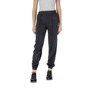 Women’s dark grey athletic joggers with black sneakers, ideal for Guess Active Trousers