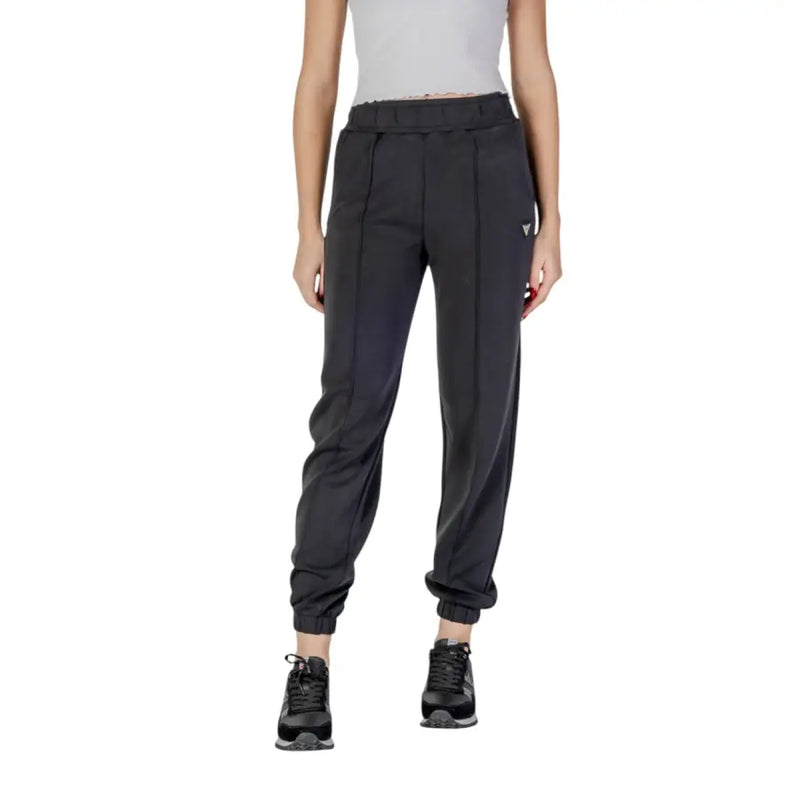 Women’s dark grey athletic joggers with black sneakers, ideal for Guess Active Trousers