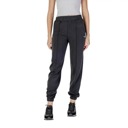 Women’s dark grey athletic joggers with black sneakers, ideal for Guess Active Trousers