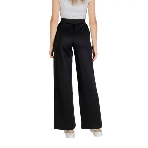 Women’s high-waisted wide-leg black trousers from Guess Active Fall Winter collection