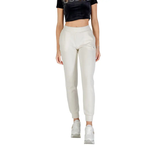 Pantalon de survêtement beige clair pour femme, avec poignets élastiques et taille à cordon. Guess Active collection