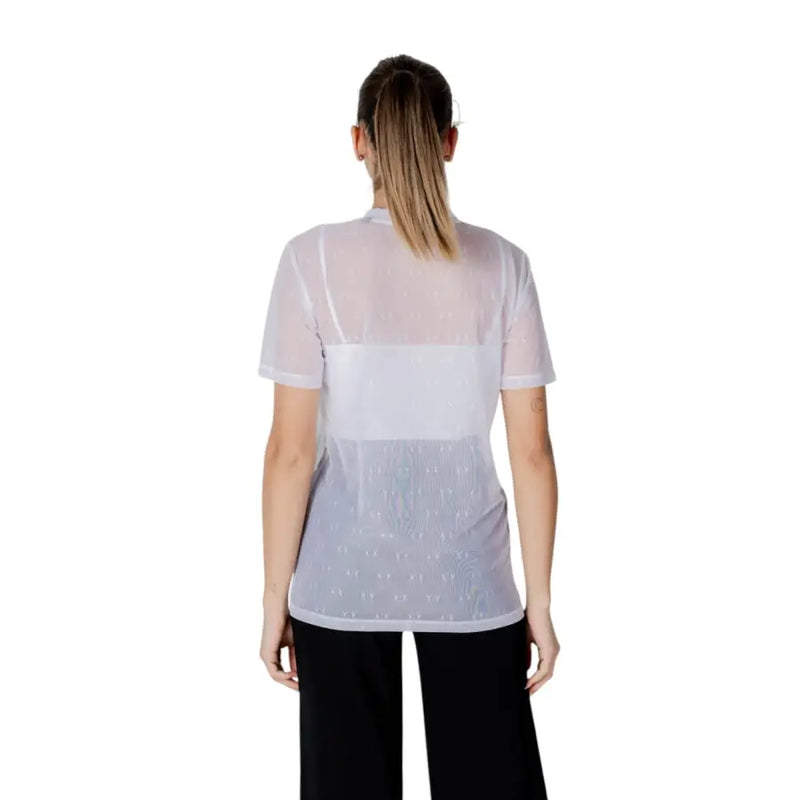 Women’s sheer white mesh top with solid white band across chest and subtle pattern on lower half