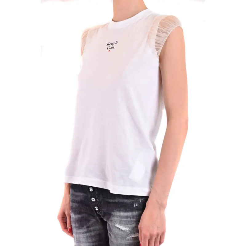Women’s white short-sleeved t-shirt with ruffled sheer shoulders and distressed jeans
