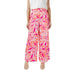 Women’s wide-leg palazzo pants with pink, orange, and white abstract leaf pattern