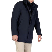 Navy blue down-filled parka with hood and quilted lining, designed by kenneth cole new york.