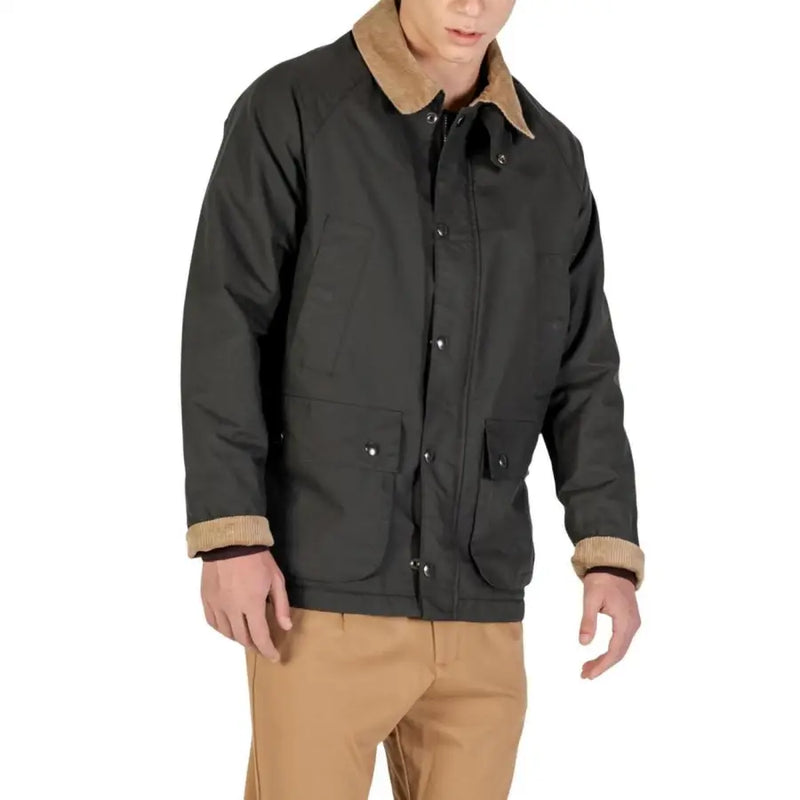 Charcoal gray barbour waxed cotton jacket with tan sherpa lining and button closure.