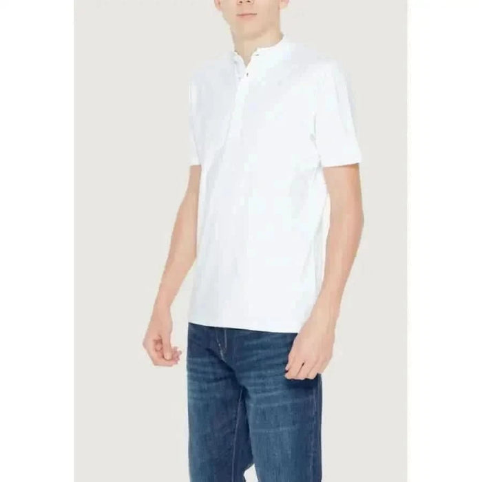 Young boy in white Hamaki-ho polo shirt, urban style men’s clothing
